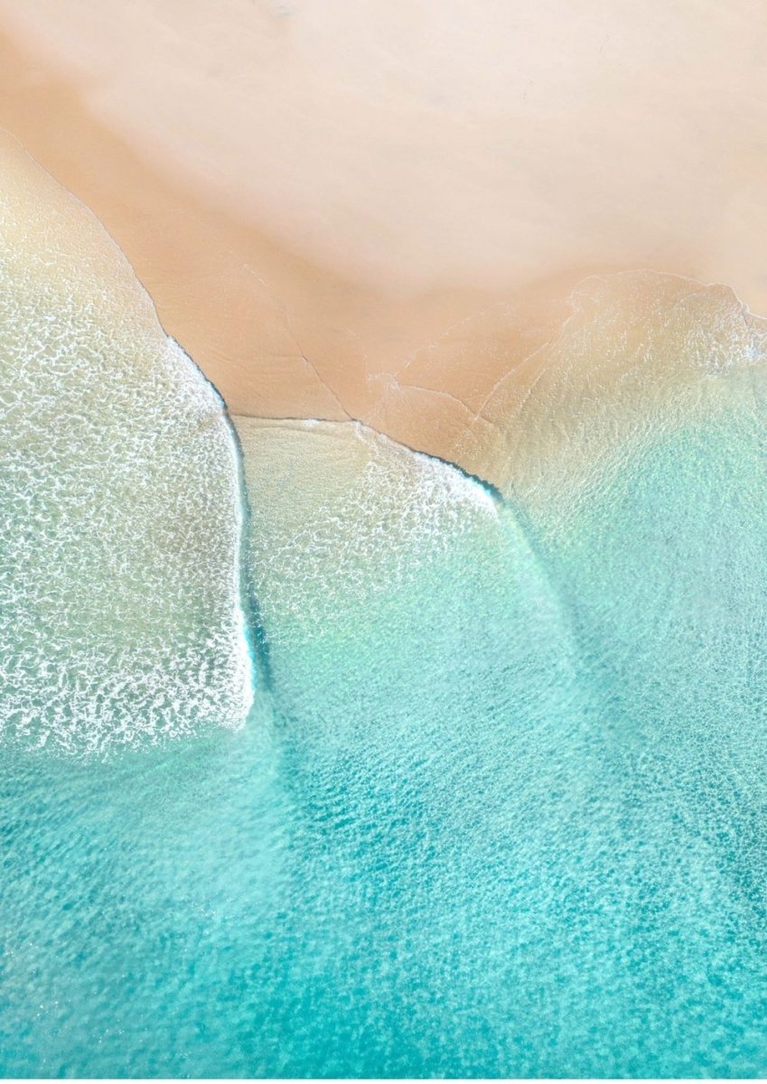 Aerial beach photo, printed and framed in timber behind a white matt